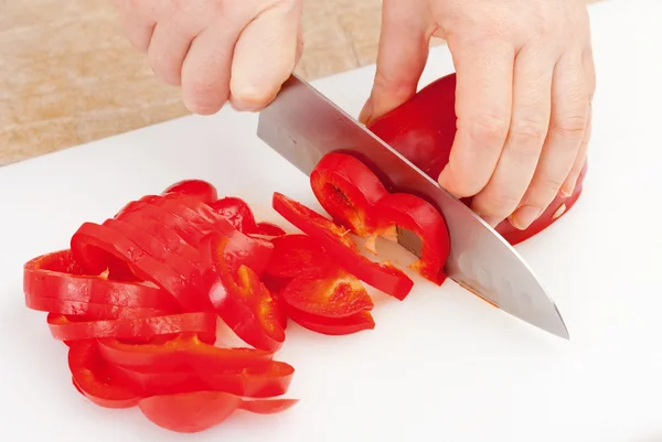 Cutting red paprika — Stock Photo, Image