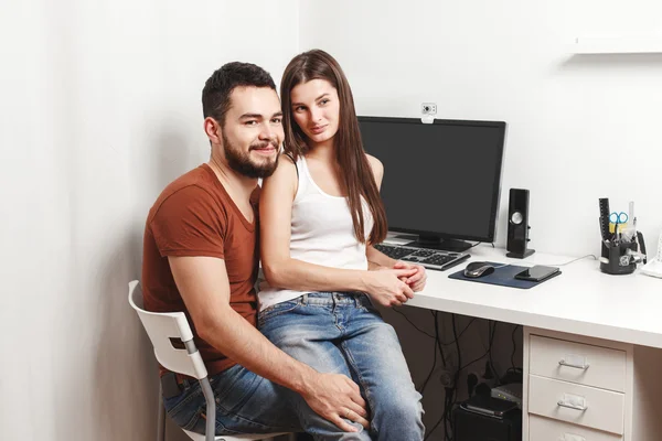 Couple sitting at the table — Stock Photo, Image