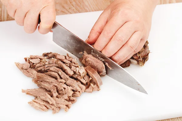 Cutting boiled beef — Stock Photo, Image