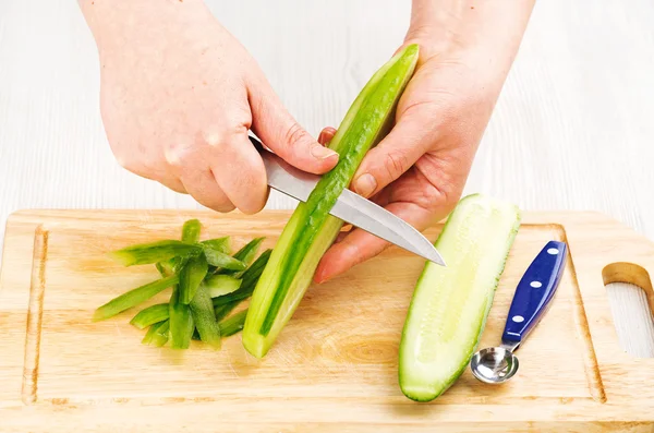 Chef clean cucumbers peeled — Stock Photo, Image