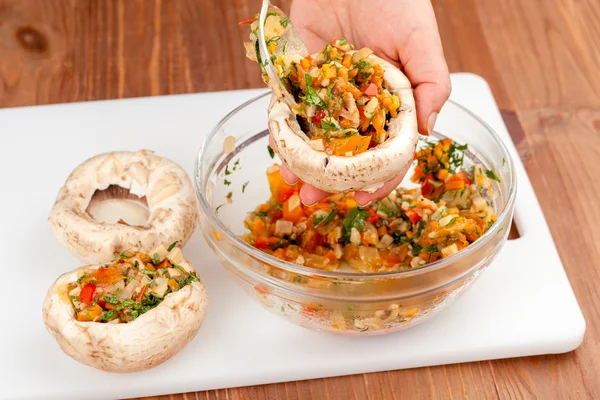 Cooking stuffed mushrooms with vegetables — Stock Photo, Image