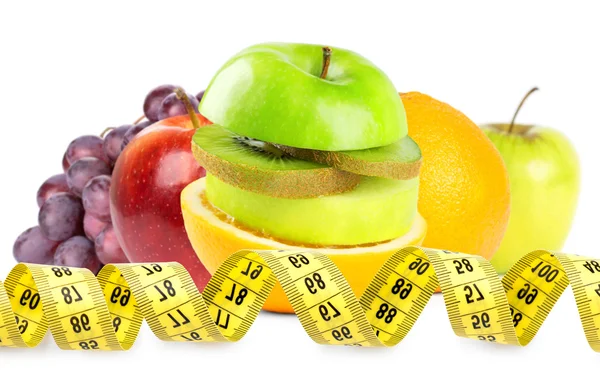 Fresh fruits and measuring tape — Stock Photo, Image