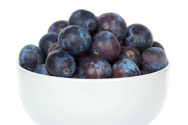 Fresh plums in bowl — Stock Photo, Image