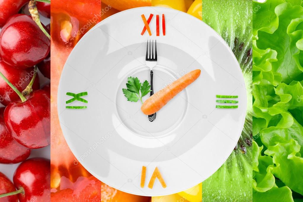 Food clock with vegetables and fruits