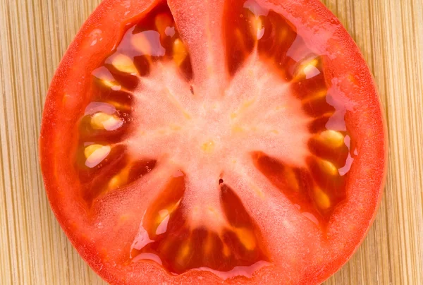 Färsk skiva tomat bakgrund — Stockfoto