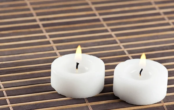 Burning candles on table — Stock Photo, Image