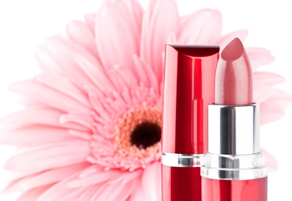 Lipstick with flower on background — Stock Photo, Image