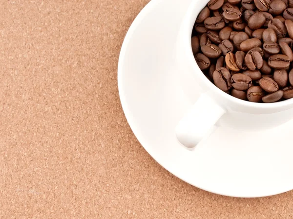 Cup with coffee beans — Stock Photo, Image