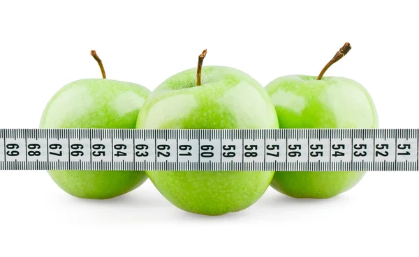 Three green apples behind meter — Stock Photo, Image