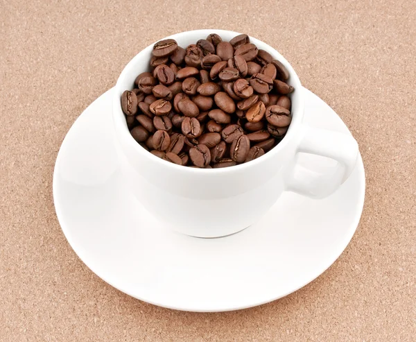 Cup with coffee beans Stock Image