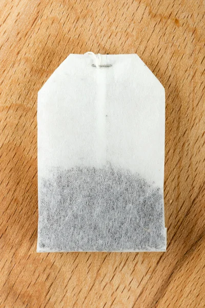 Teabag on wooden background — Stock Photo, Image