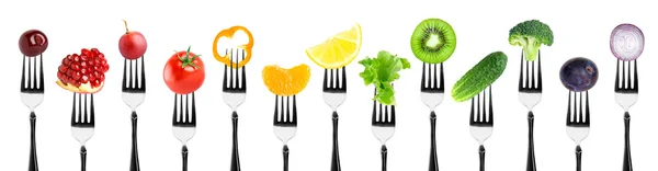 Color fruits and vegetables on fork — Stock Photo, Image