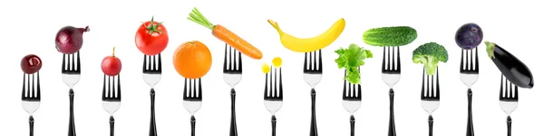Fruits and vegetables on fork — Stock Photo, Image