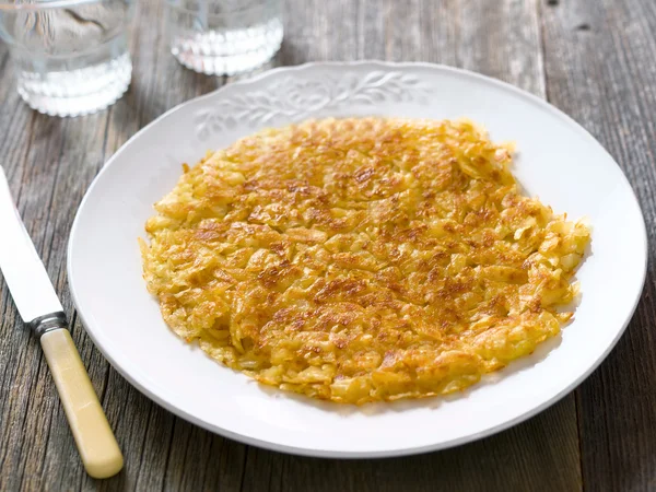 Rustic golden crispy swiss rosti — Stock Photo, Image