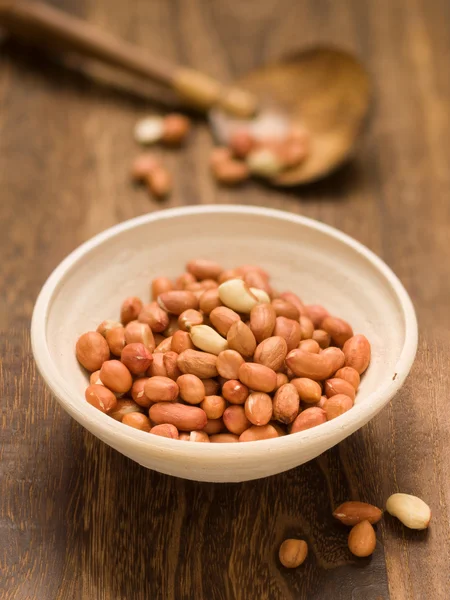 Rustic raw uncooked peanuts — Stock Photo, Image