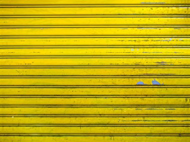 Grunge parlak sarı rulo perde kapı doku arka plan