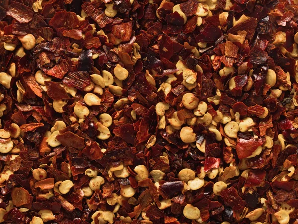 Dried red chili flake food background — Stock Photo, Image