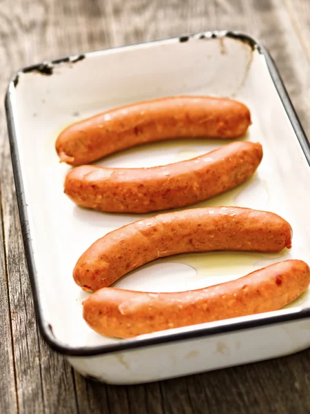 Tray of rustic uncooked sausages — Stock Photo, Image