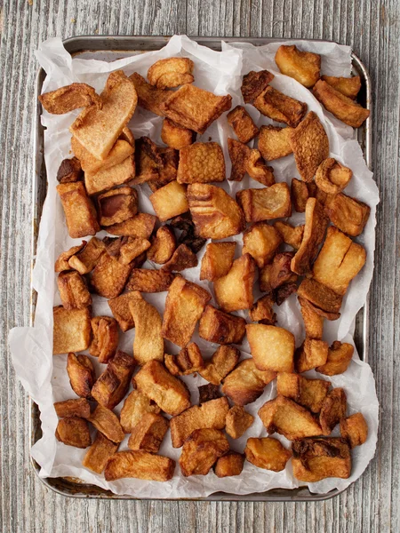 Rustic deep fried crispy pork rind — Stock Photo, Image