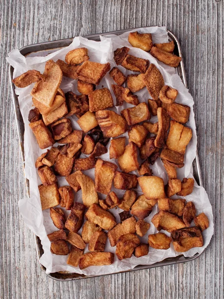 Rustic deep fried crispy pork rind — Stock Photo, Image