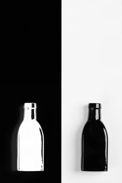 Negative reflection of the vintage  small black bottle — Stock Photo, Image