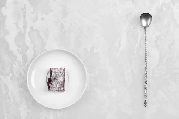 White dish with fruit candy and antique silver spoon — Stock Photo, Image