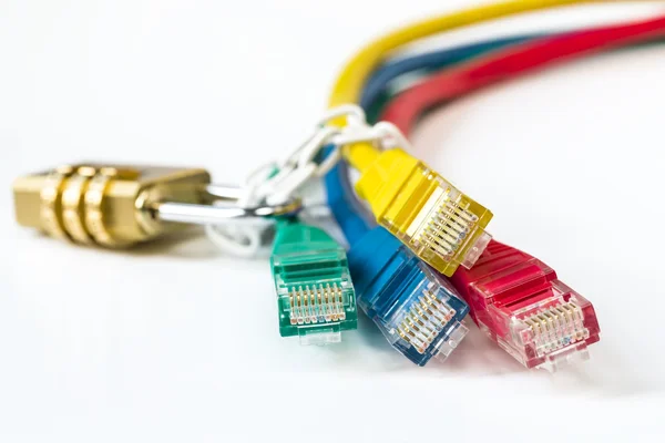 Colorful network cables secured lock with chain — Stock Photo, Image