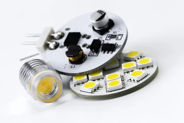 Two different types of G4 LED bulbs and electronics side of led — Stock Photo, Image
