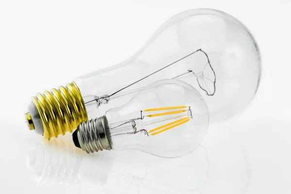LED bulb E27 10W compared with 300W tungsten E40 — Stock Photo, Image