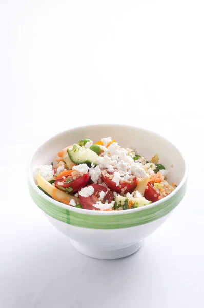 quinoa and chickpea salad with feta, cucumber and tomato