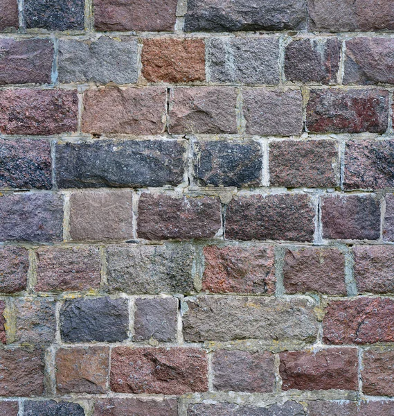 Parede de pedra sem costura de um tijolo de granito — Fotografia de Stock