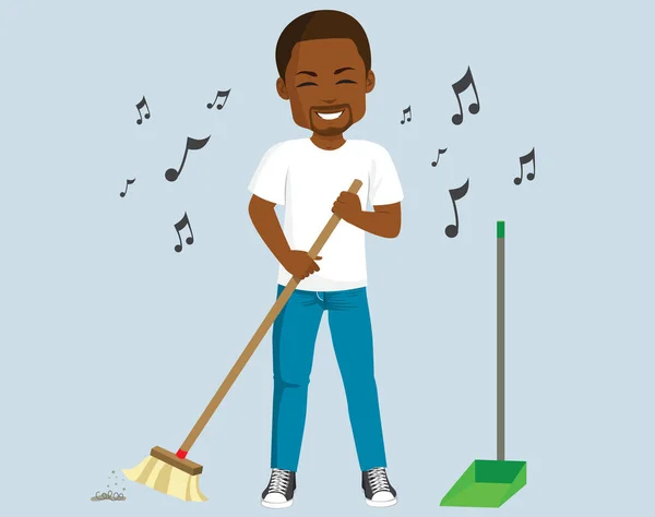 Young Black Man Singing Sweeping Floor Doing House Chores —  Vetores de Stock