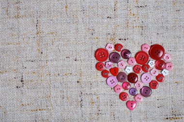 Sewing buttons in a heart shape