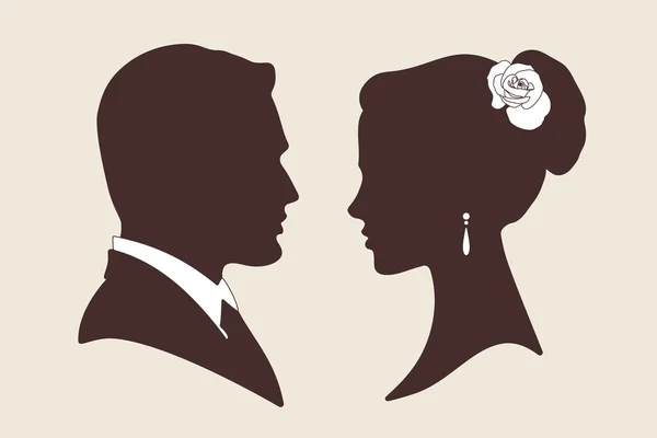 Vector silhouettes of groom and bride — Stock Vector