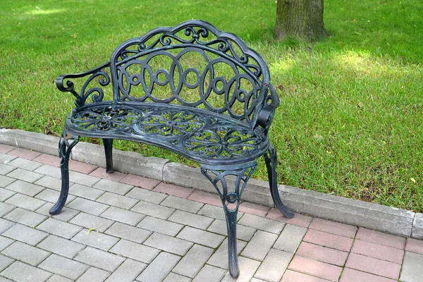 Decorative metal bench in park. St. Petersburg