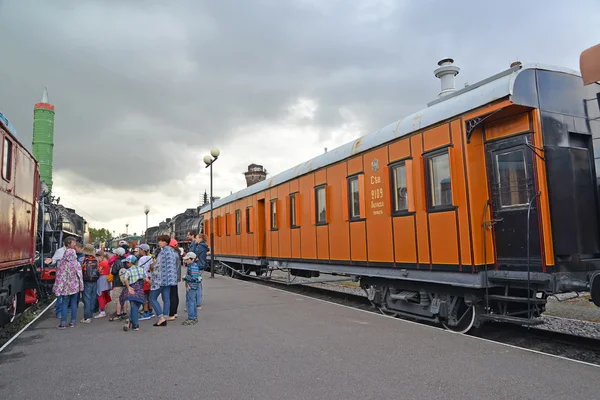 ST. PETERSBURG, RUSSIA - JULY 23, 2015: School excursion group in the Museum of railway equipment