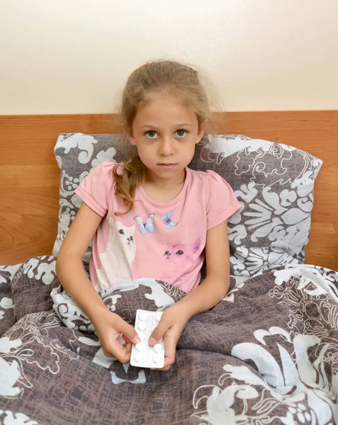 Little Girl Holds Package Pills Lying Bed Self Treatment — Stock Photo, Image