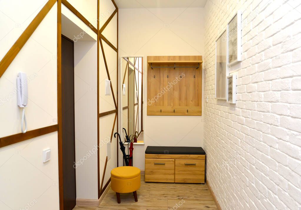 Wardrobe in the hallway with imitation half-timbered construction on the wall