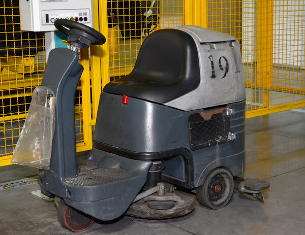 The car for washing of a floor with a place for the operator cos