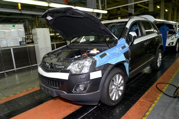 Cars stand on the conveyor line of assembly shop. Automobile pro — Stock Photo, Image