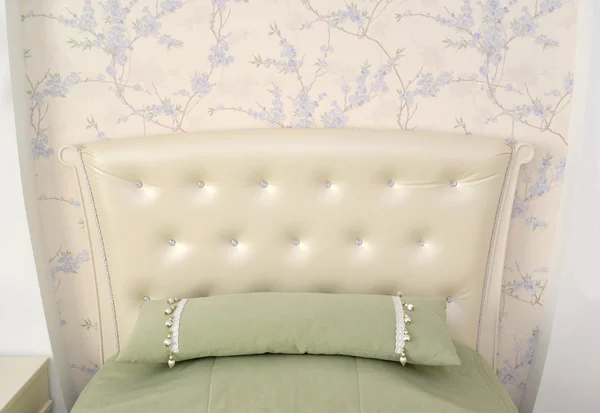 Headboard of a single bed with a throw pillow. Modern classics w — Stock Photo, Image