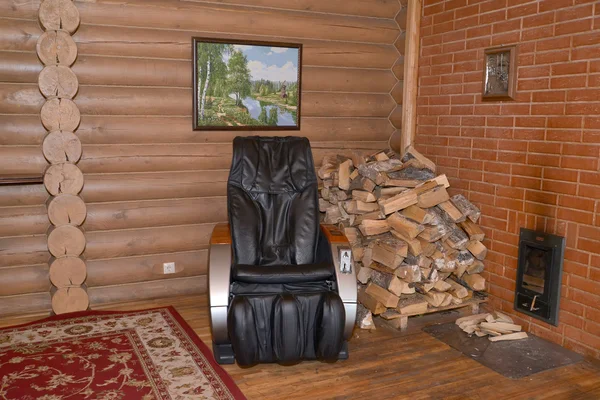 Silla de masaje y leña en una sauna — Foto de Stock