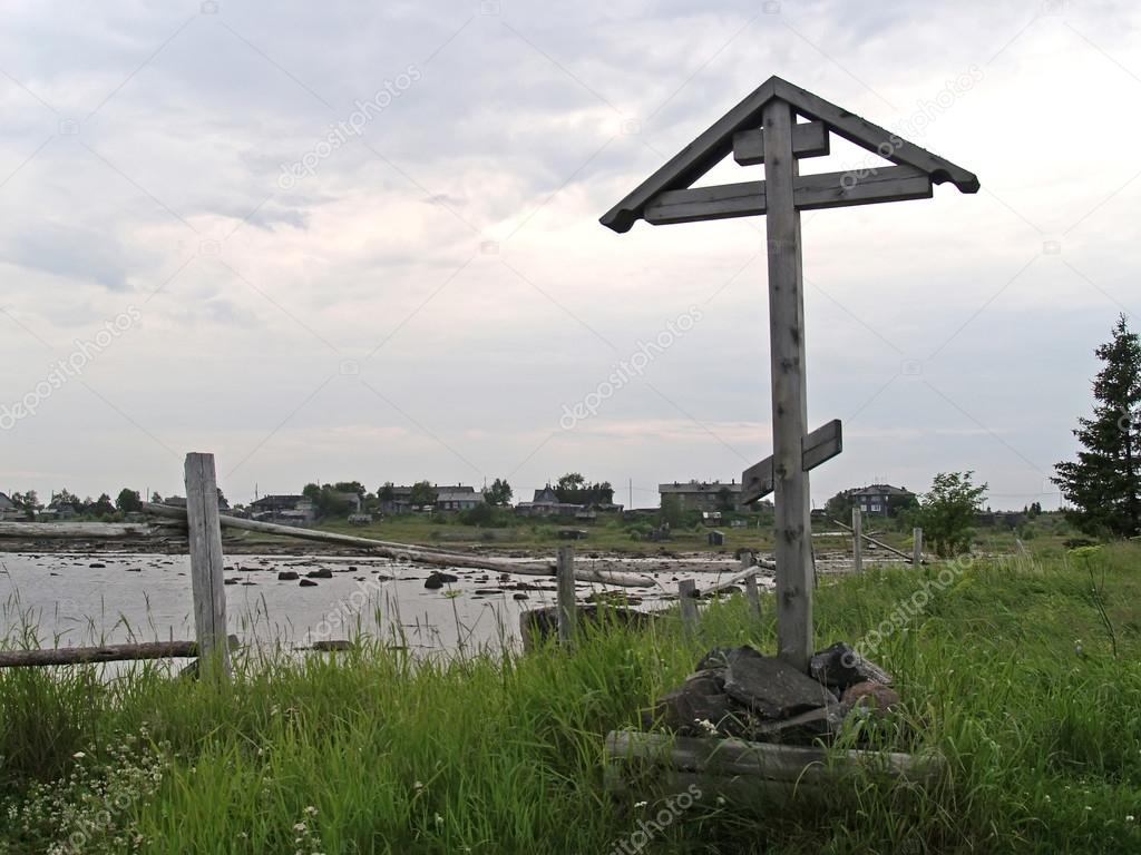 Wooden funeral cross on the bank of the White Sea. Karelia, Russ