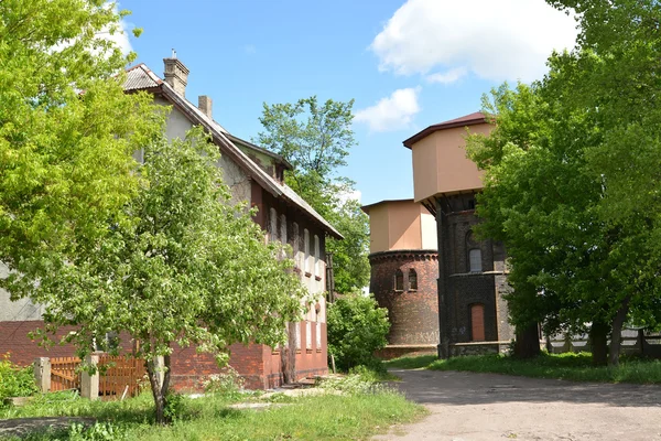 View of two railway water towers (1890 and 1907) and old house — Stock Photo, Image