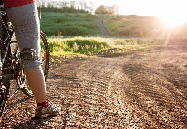 Woman cycling outdoors — Stock Photo, Image