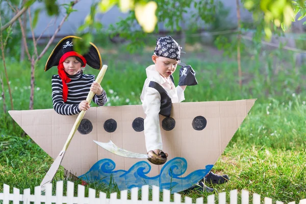 Children play pirates at backyard — Stock Photo, Image