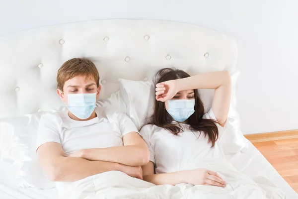 Couple in bed suffering common cold — Stock Photo, Image