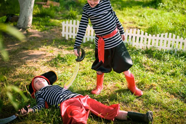 Children play pirates at backyard — Stock Photo, Image