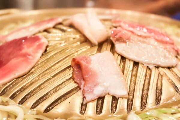 Grilling raw sliced pork — Stock Photo, Image