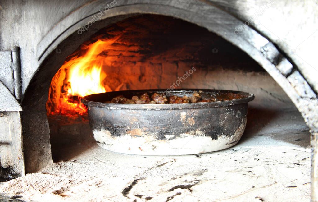 Kebab is cooked on wood fire. Turkey Konya. Brick stove.